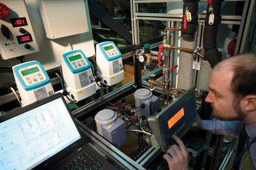 Employee conducting a heat pump test in a controled facility