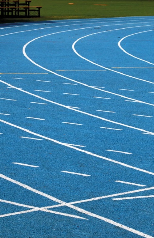 A blue sport facility with a athletics track field
