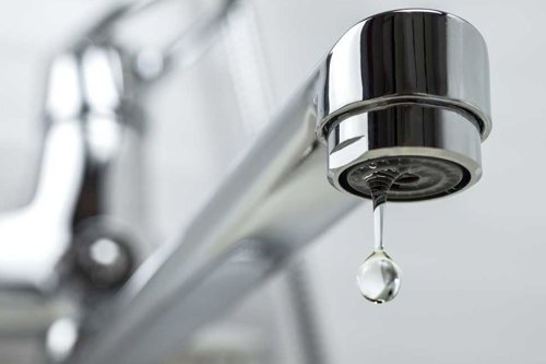 single drop of water falling from a tap