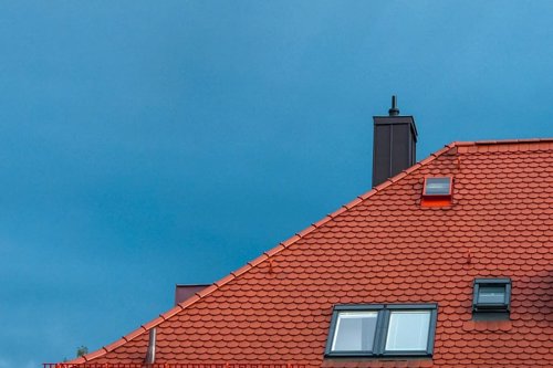 partial image if a roof with roof light, windows and an ancillary product