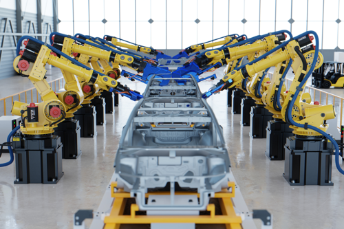 Robotic arms assembling a car frame in an automotive factory.