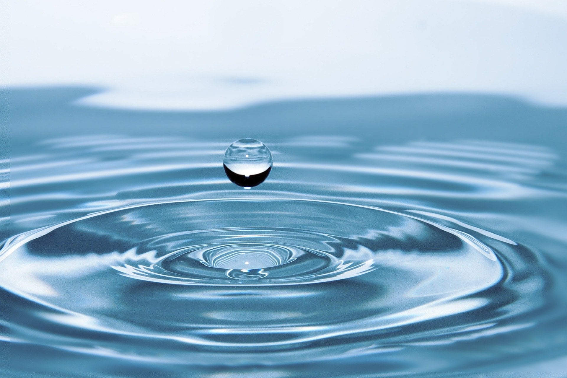 Tapping a glass of water in the kitchen