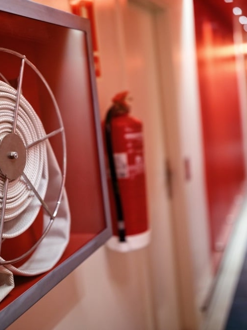 Fire hose reel and a fire extinguisher for fire safety and security