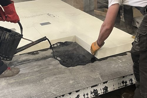 Dakopbouw gieten met gieter