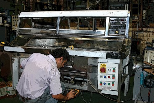 Employee testing a catering equipment